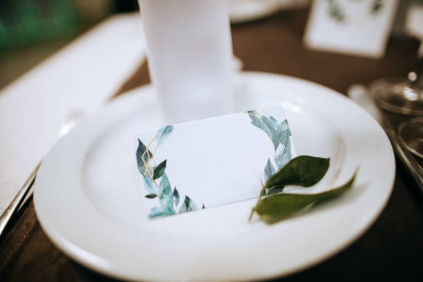 istock Plate with boarding card for wedding guests. Elegant table 1204393479