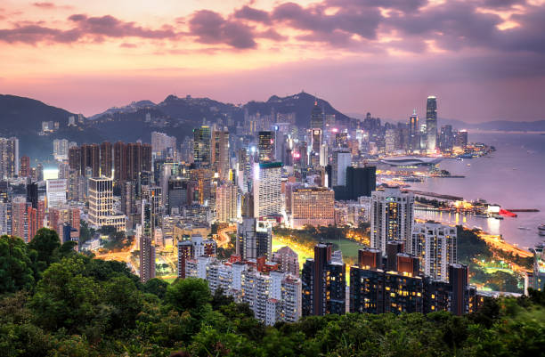 istock Hong Kong skyline at sunset from Braemar Hill Peak 1204395047
