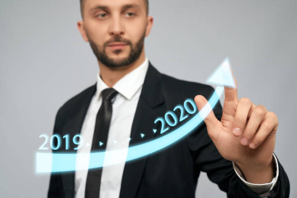 istock Young businessman touching virtual arrow. 1204395982