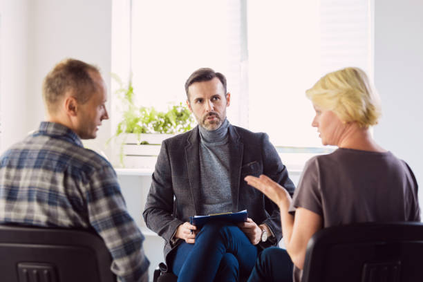 istock Psychotherapist talking with troubled couple 1204396019