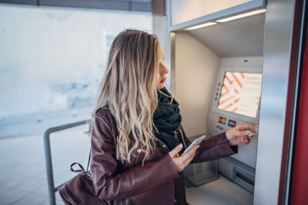 istock One teenage girl using ATM machine 1204397007