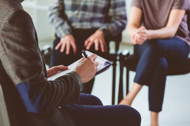 istock Troubled couple talking with psychotherapist 1204397015