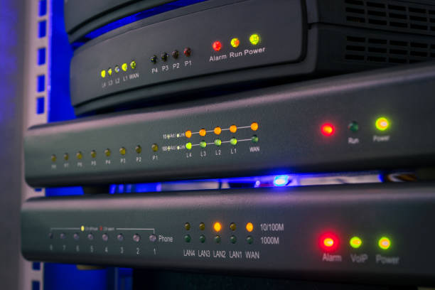 istock Communication equipment for voice Internet connection. Network gateways for ip telephony work in the server room. Color indication on the interfaces of office telephone routers. Technology concept 1204400777