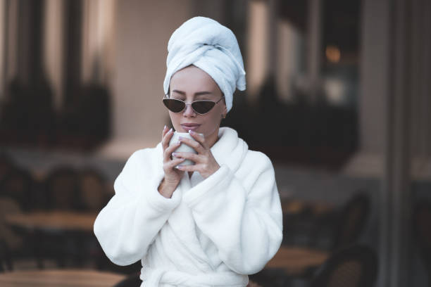 istock Girl wearing bathrobe 1204401294