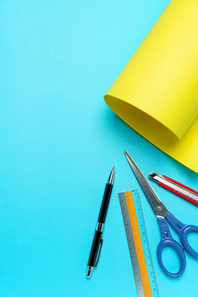 Photo of Construction paper, scissors, cutter knife, ruler, and pen