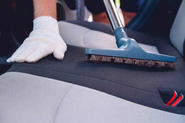 istock Vacuum cleaning car seats. Auto service 1204405753