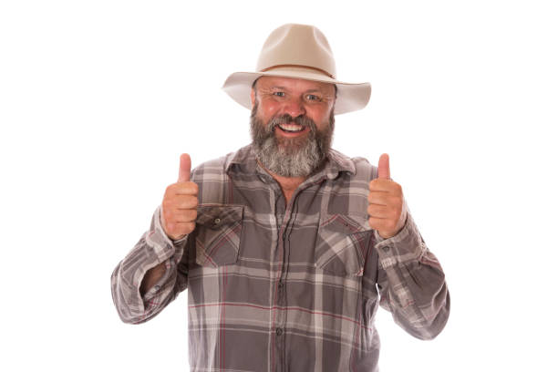 A mature Australian guy giving thumbs up, isolated on white.