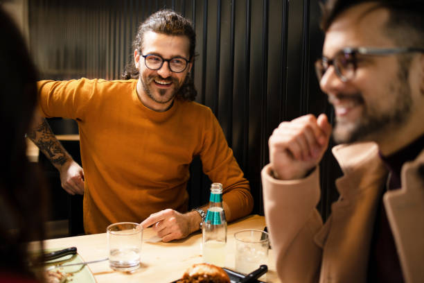 istock Young man in Fast Food Restaurant 1204408130