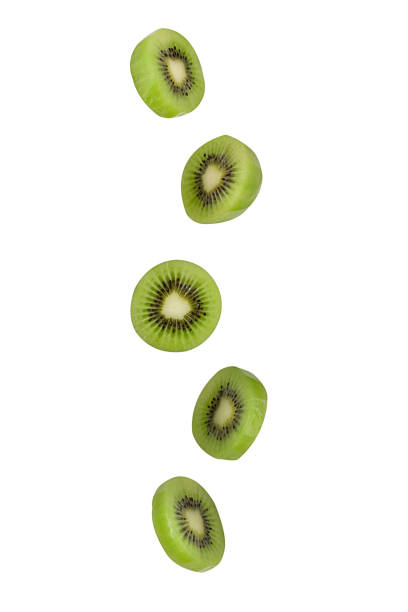 istock Falling kiwi isolated on white background with clipping path as package design element and advertising. Flying foods. 1204408378
