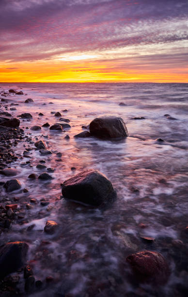 istock Purple sunset over beautiful beach. 1204409640