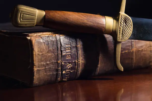 Ancient sword beside a 150 Year Old Bible