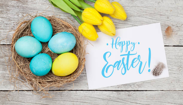 istock Easter greeting card with eggs and tulips 1204412775