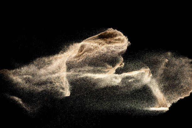 istock Dry river sand explosion isolated on black background. Abstract sand cloud.Brown colored sand splash. 1204414258