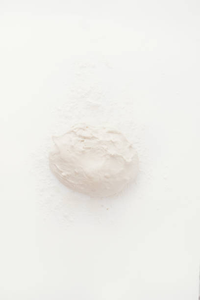 istock Baking cereal bread a Step by step guide to bake cereal bread,  top view on a white board, after 12 hours or more the dough is ready 1204415864