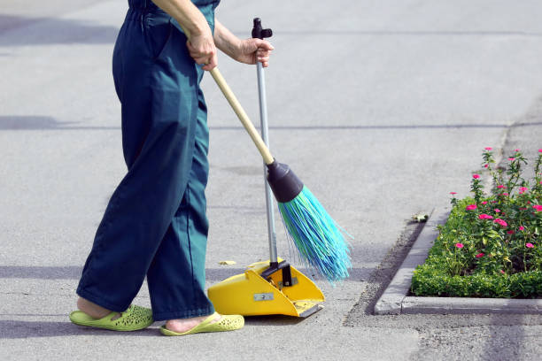 istock the janitor sweeping broom street 1204415974