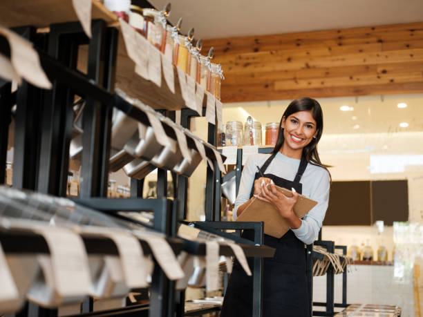 istock Happy latin employee holding clipboard and smiling at camera 1204417183