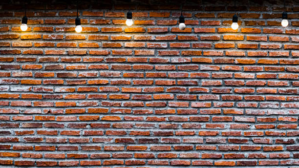 istock Red brick wall with bulbs vintage and retro background 1204418644
