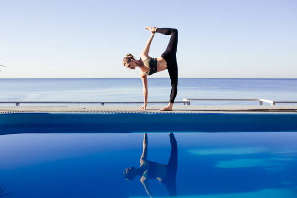istock Young attractive woman practicing yoga 1204418895
