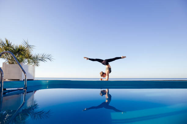 istock Young attractive woman practicing yoga 1204418923