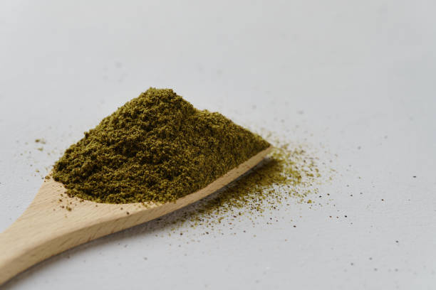 istock Hemp flour on a wooden spoon. 1204418938