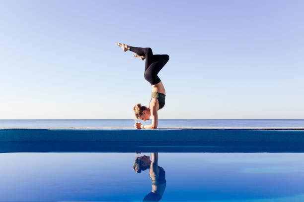 istock Young attractive woman practicing yoga 1204418977
