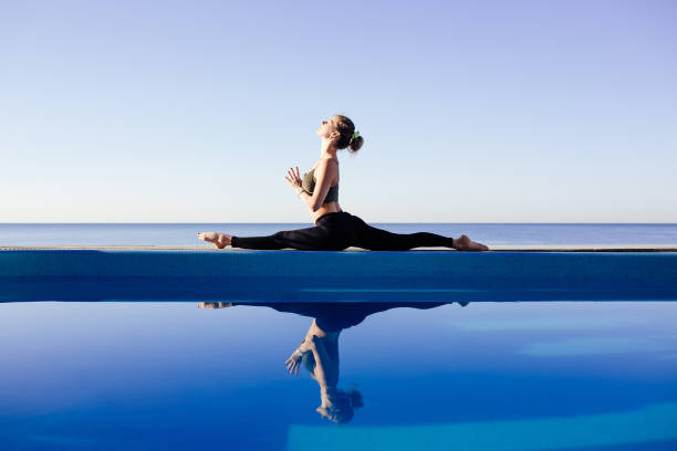 istock Young attractive woman practicing yoga 1204419012