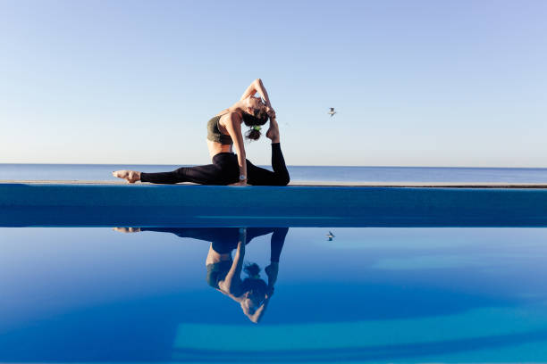 istock Young attractive woman practicing yoga 1204419565