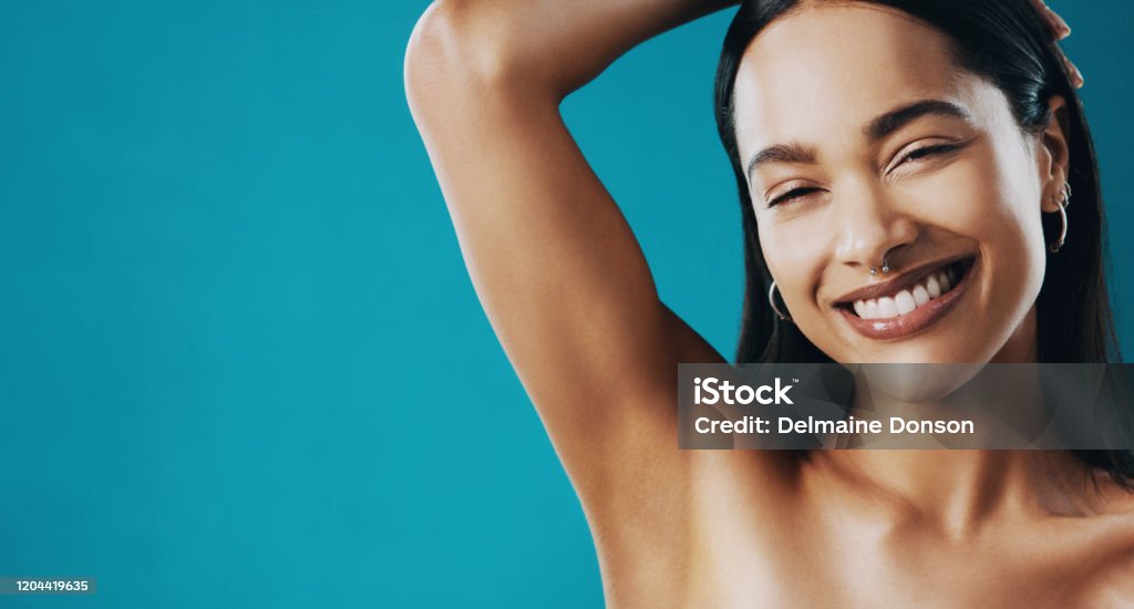 Your underarms require proper care too Cropped shot of a beautiful young woman showing off her underarms Armpit Stock Photo