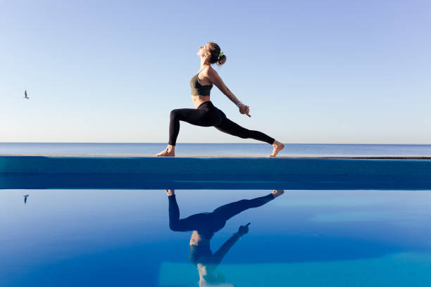 istock Young attractive woman practicing yoga 1204419780