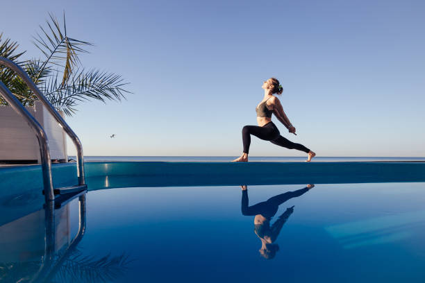 istock Young attractive woman practicing yoga 1204419819
