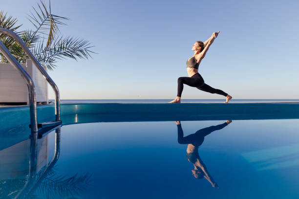 istock Young attractive woman practicing yoga 1204419849