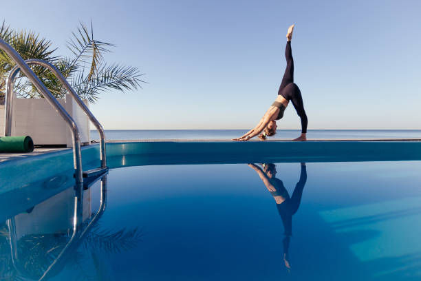 istock Young attractive woman practicing yoga 1204419891