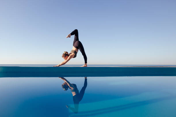 istock Young attractive woman practicing yoga 1204419977