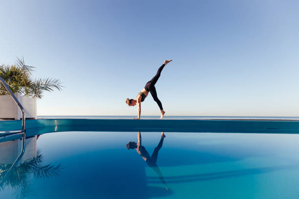 istock Young attractive woman practicing yoga 1204420034