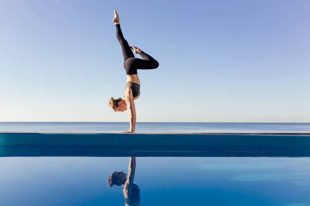 istock Young attractive woman practicing yoga 1204420104