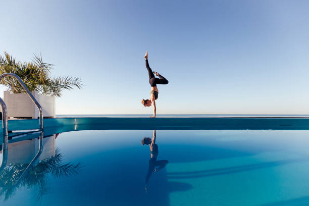 istock Young attractive woman practicing yoga 1204420147