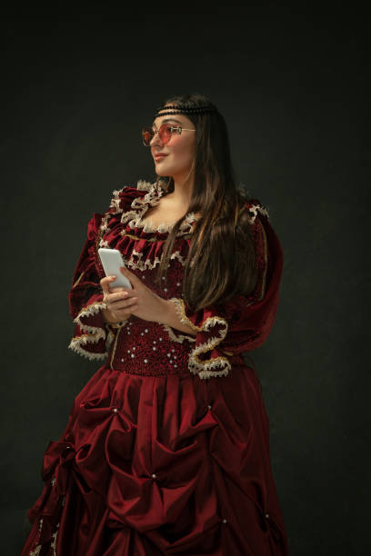 istock Medieval young woman in old-fashioned costume 1204420439
