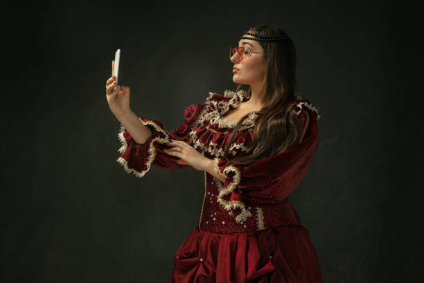istock Medieval young woman in old-fashioned costume 1204420473