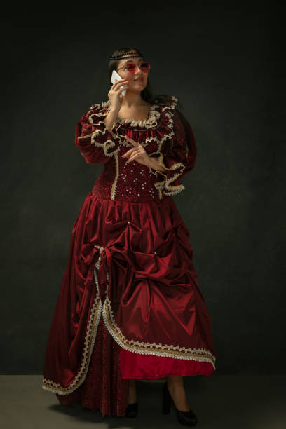 istock Medieval young woman in old-fashioned costume 1204420520