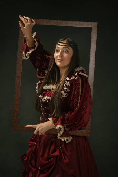 istock Medieval young woman in old-fashioned costume 1204420565