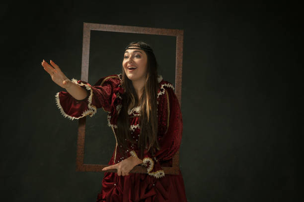 istock Medieval young woman in old-fashioned costume 1204420598