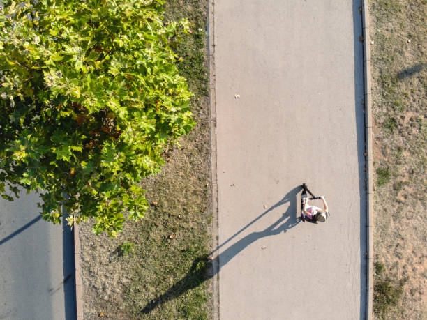 istock Woman driving electric scooter 1204420804