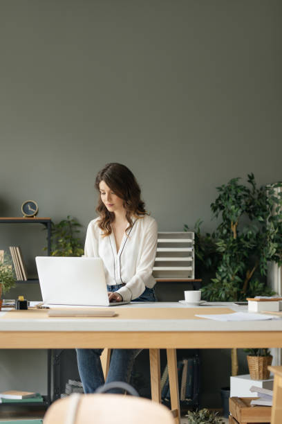 istock Young Businesswoman Working at Modern Office 1204422014