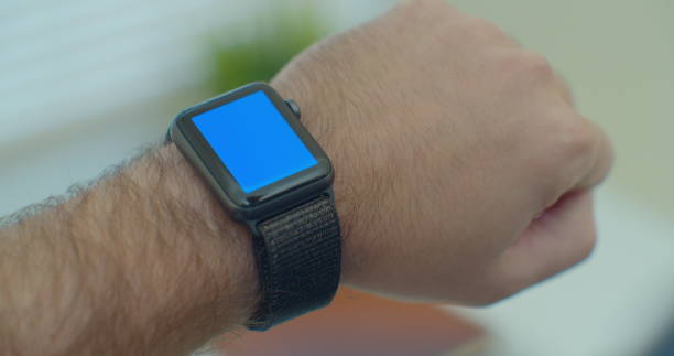 istock Man hands use smartwatch with blue screen chromakey content touch display communication close up connection internet contact clock electronic gadget interface. 1204422227