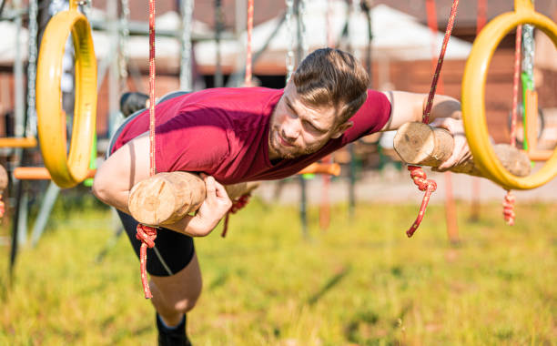 Hanging rings obstacle overcome by runner at the extreme race
