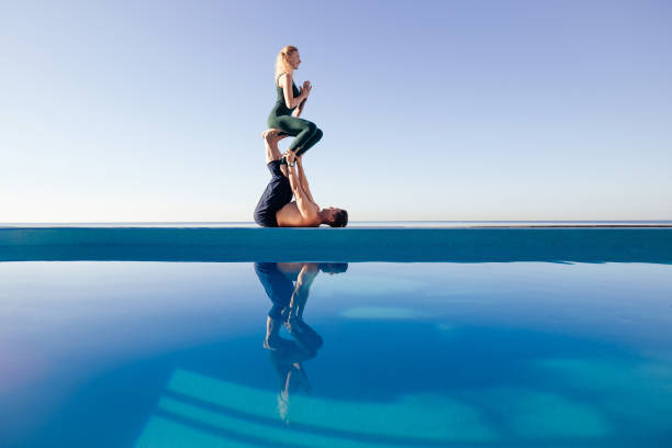 istock Acro yoga concept. Pair yoga. 1204422487