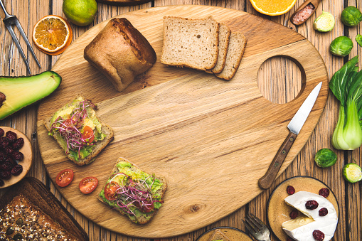 cutting board and breakfast ingredients