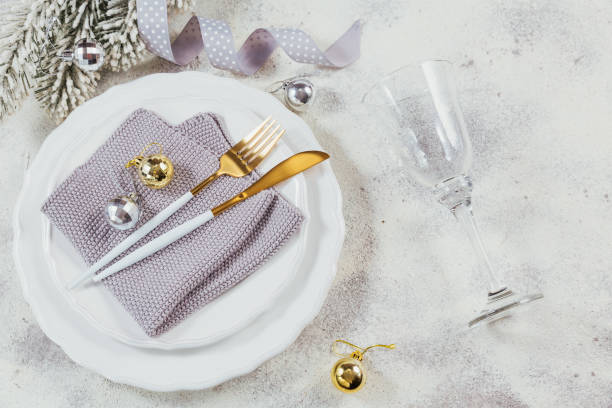 istock Christmas table place setting and winter holiday decorations 1204425510