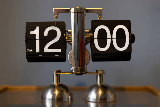 Mechanical analog vintage flip clock - showing 12.00 PM