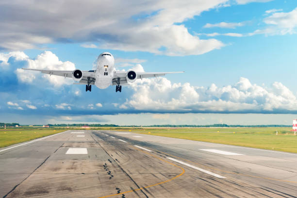 istock Passenger plane is landing runway from airport. 1204426229